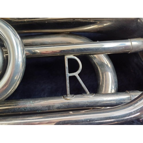 664 - A cased marching Baritone horn with two 6.5 ALL-L mouthpieces