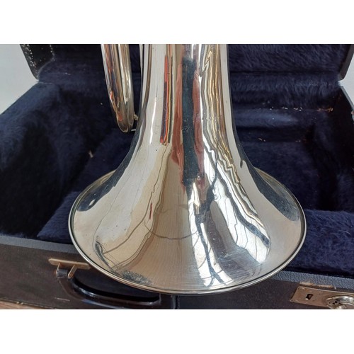 664 - A cased marching Baritone horn with two 6.5 ALL-L mouthpieces