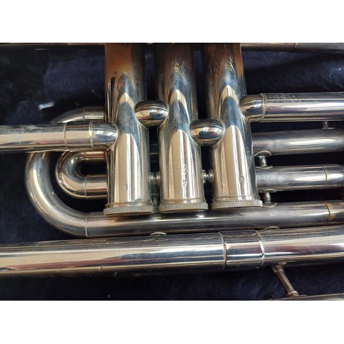 664 - A cased marching Baritone horn with two 6.5 ALL-L mouthpieces