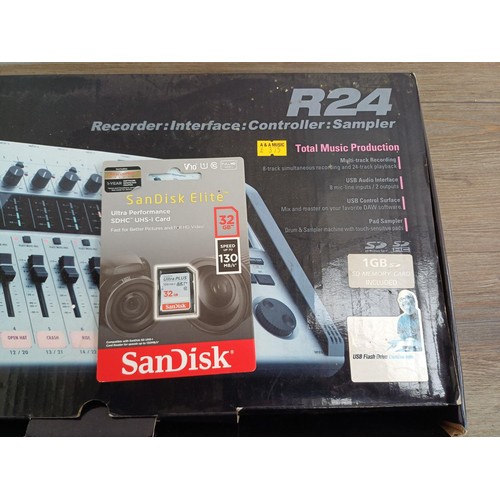 666 - A boxed Zoom R24 USB Recorder/Interface/Controller/Sampler with operation manual and packaged SanDis... 