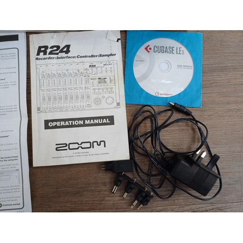 666 - A boxed Zoom R24 USB Recorder/Interface/Controller/Sampler with operation manual and packaged SanDis... 