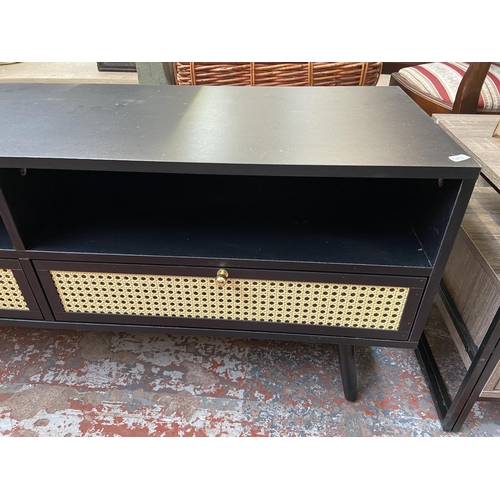 71 - A Vonhaus Whitworth black laminate and cane two drawer TV stand - approx. 51cm high x 120cm wide x 4... 