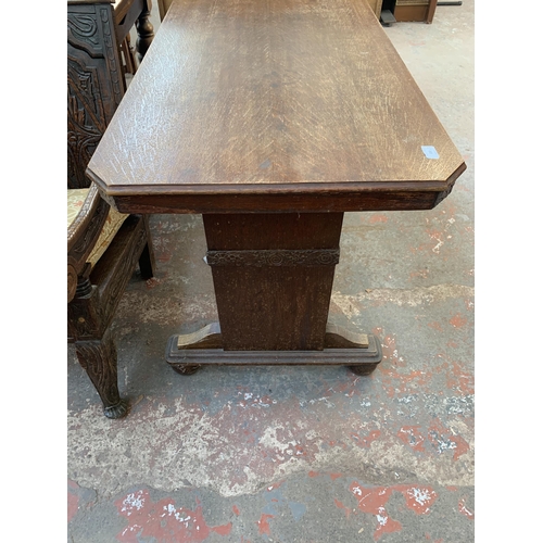 78 - An Art Deco carved oak octagonal drop leaf dining table and two chairs - approx. 74cm high x 106cm w... 