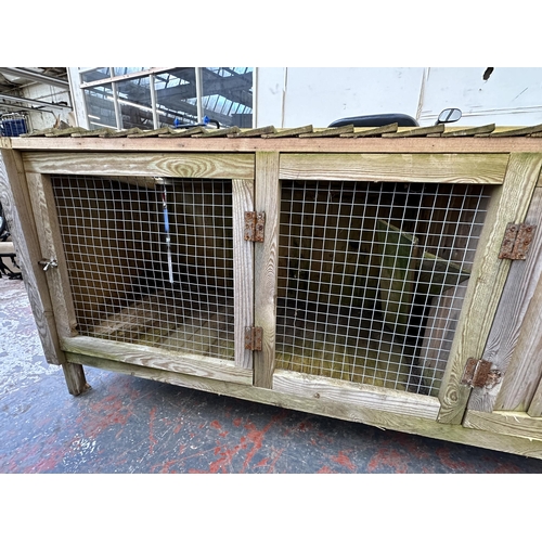 792 - An outdoor rabbit hutch - approx. 82cm high x 144cm wide x 66cm deep