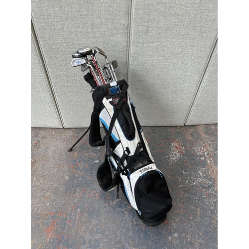 797 - A golf bag containing golf clubs to include Radar, Wilson Staff, Taylor Made etc.