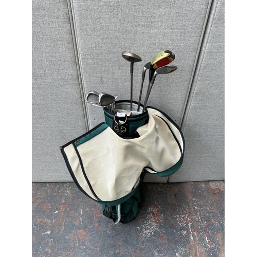 798 - A golf bag containing golf clubs to include Cobra, Ping, Masters etc.