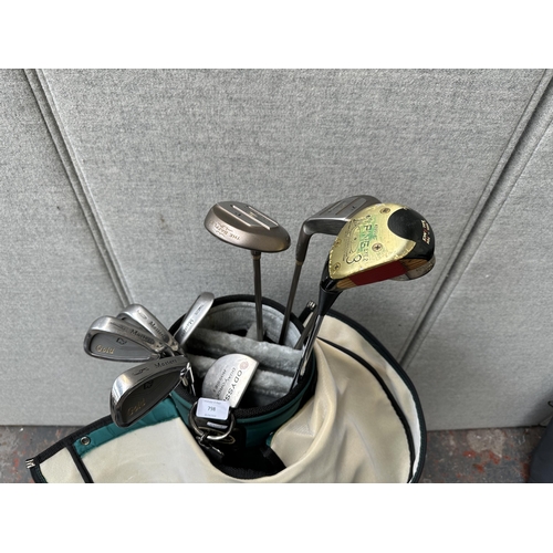 798 - A golf bag containing golf clubs to include Cobra, Ping, Masters etc.