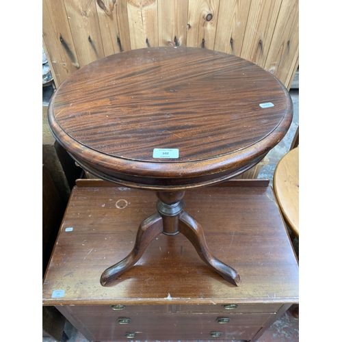 102 - A Victorian style mahogany circular tripod side table - approx. 65cm high x 49cm diameter