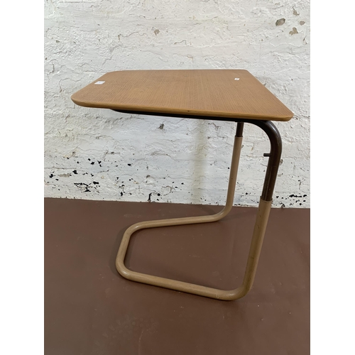 111 - A mid 20th century Staples & Co. Ltd. oak and tubular metal Cantilever table - approx. 65cm high x 5... 