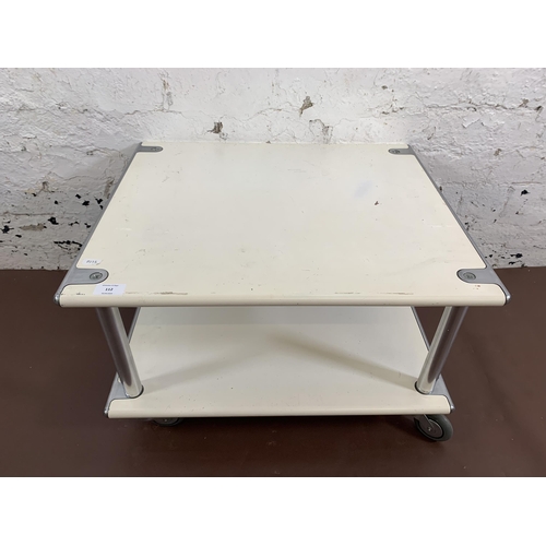 112 - A 1970s white metal and chrome plated two tier coffee table on castors - approx. 39cm high x 60cm wi... 