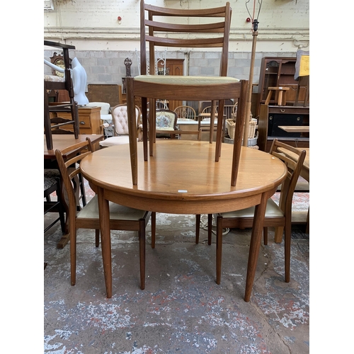 144 - A mid 20th century G Plan Fresco teak circular extending dining table and six chairs - table approx.... 