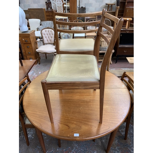 144 - A mid 20th century G Plan Fresco teak circular extending dining table and six chairs - table approx.... 