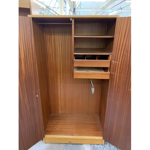 158 - A 1950s G Plan Brandon oak double wardrobe - approx.