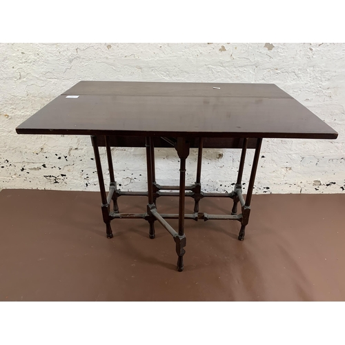 175 - A late 19th/early 20th century mahogany drop leaf spider table - approx. 65cm high x 77cm wide x 76c... 