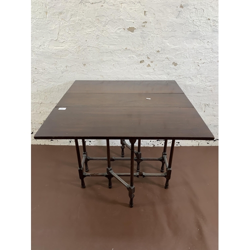 175 - A late 19th/early 20th century mahogany drop leaf spider table - approx. 65cm high x 77cm wide x 76c... 