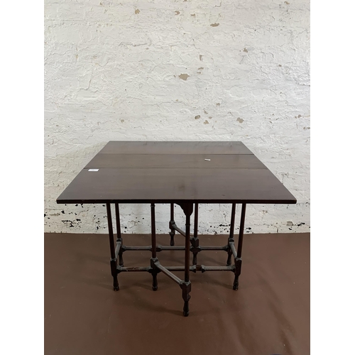 175 - A late 19th/early 20th century mahogany drop leaf spider table - approx. 65cm high x 77cm wide x 76c... 