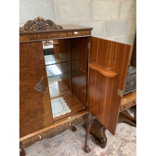 19 - A Queen Anne style walnut cocktail cabinet on ball and claw supports - approx. 168cm high x 87cm wid... 