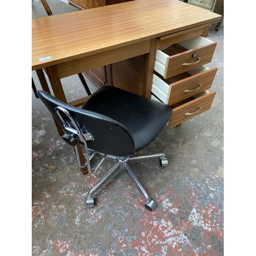 45 - A mid 20th century teak office desk with black vinyl and chrome plated swivel desk chair