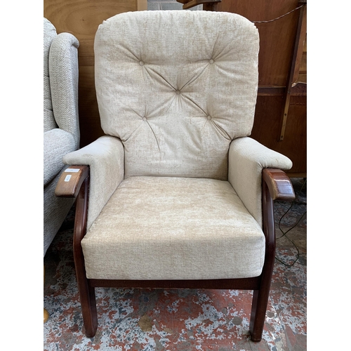 63 - A mid 20th century beech and fabric upholstered armchair