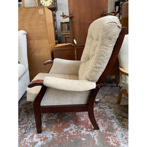 63 - A mid 20th century beech and fabric upholstered armchair