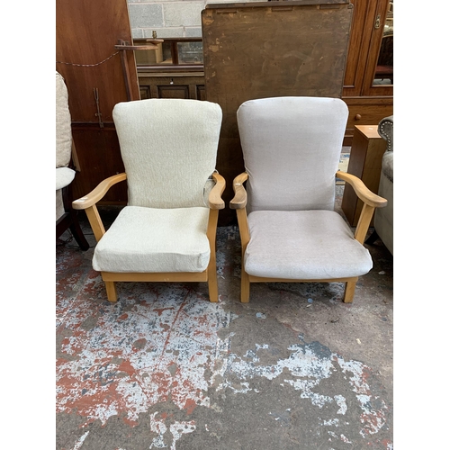 64 - A pair of mid 20th century beech and fabric upholstered armchairs