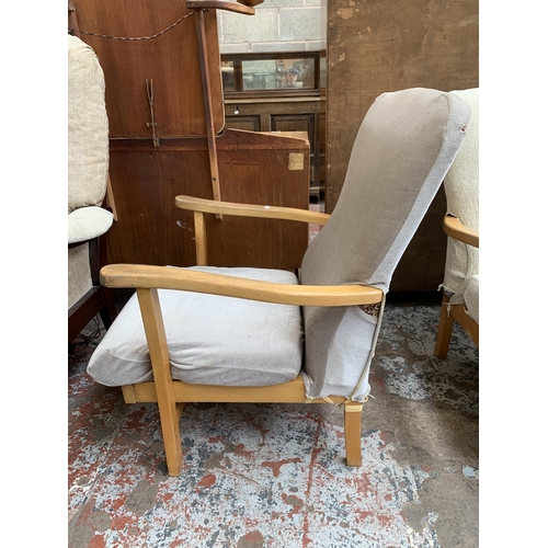 64 - A pair of mid 20th century beech and fabric upholstered armchairs