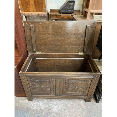 69 - An 18th century style carved oak blanket box - approx. 56cm high x 91cm wide x 45cm deep