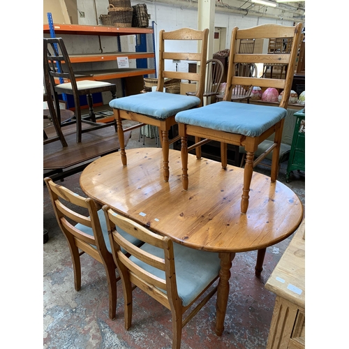 80 - A modern pine extending dining table and four chairs approx. 73cm high x 90cm wide x 150cm long