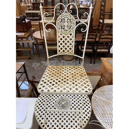 85 - A Victorian style white metal circular folding patio table and chair - approx. 77cm high x 63cm diam... 