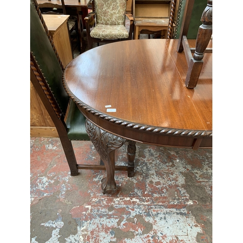 87 - A 19th century mahogany wind out dining table on ball and claw supports and four carved oak and gree... 