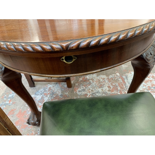 87 - A 19th century mahogany wind out dining table on ball and claw supports and four carved oak and gree... 