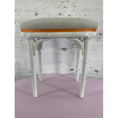 88 - A white painted faux bamboo oval dressing table and stool - approx. 75cm high x 90cm wide x 56cm dee... 