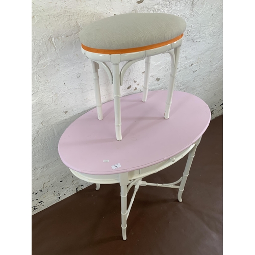 88 - A white painted faux bamboo oval dressing table and stool - approx. 75cm high x 90cm wide x 56cm dee... 