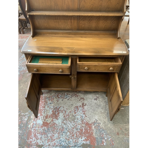 89 - An Ercol Golden Dawn elm dresser - approx. 160cm high x 123cm wide x 48cm deep