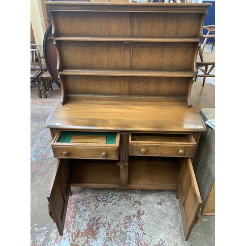 89 - An Ercol Golden Dawn elm dresser - approx. 160cm high x 123cm wide x 48cm deep