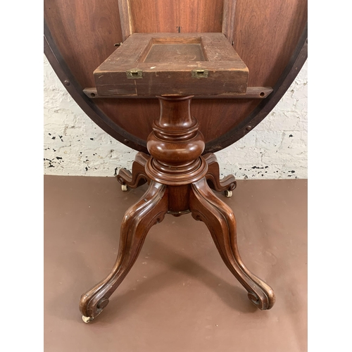 93 - A Victorian mahogany oval tilt top breakfast table on quatrefoil base - approx. 145cm high when tilt... 