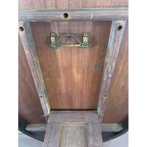 93 - A Victorian mahogany oval tilt top breakfast table on quatrefoil base - approx. 145cm high when tilt... 