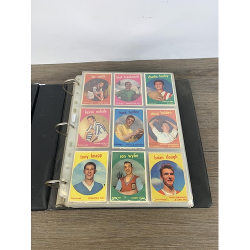 380 - Three albums and two boxes containing a large collection of vintage football collector's cards to in... 