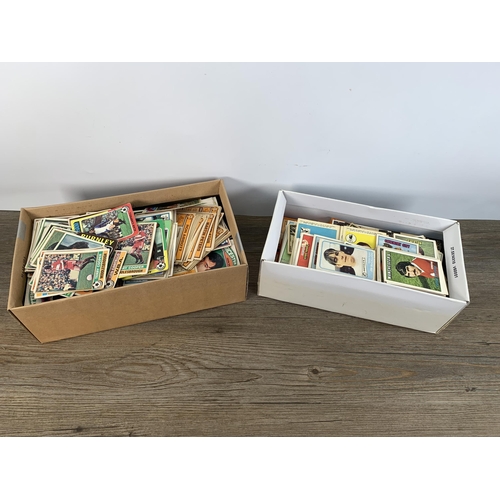 380 - Three albums and two boxes containing a large collection of vintage football collector's cards to in... 