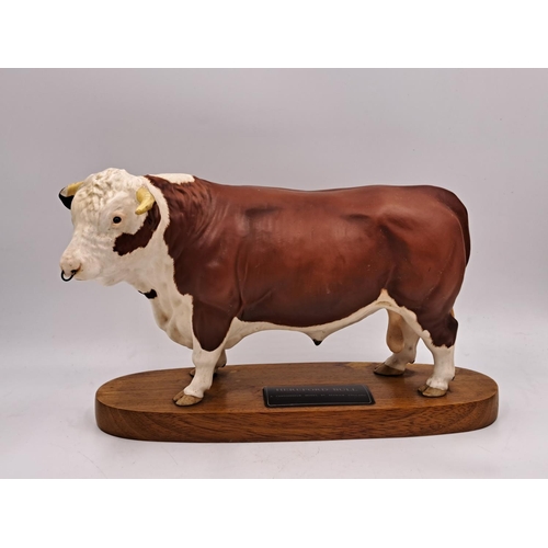 294 - Two Beswick Connoisseur models on wooden plinths, one Hereford Bull and one Charolais