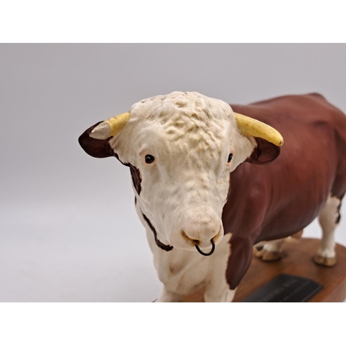 294 - Two Beswick Connoisseur models on wooden plinths, one Hereford Bull and one Charolais