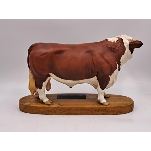 294 - Two Beswick Connoisseur models on wooden plinths, one Hereford Bull and one Charolais