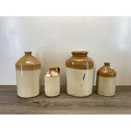 305 - Four pieces of early 20th century salt glazed stoneware, three flagons and one jar