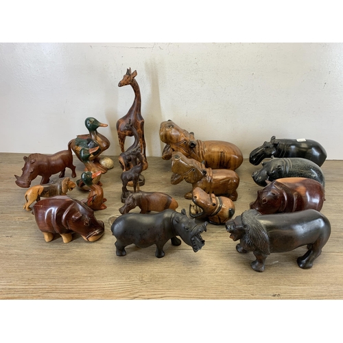 566 - A large collection of carved stone and treen animal figurines