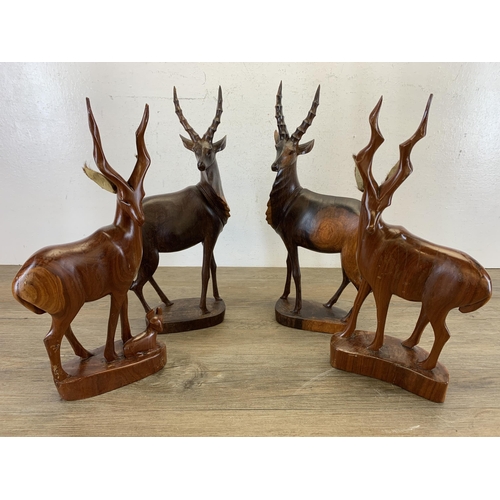 567 - Four mid/late 20th century carved hardwood antelope figurines