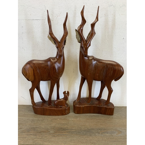 567 - Four mid/late 20th century carved hardwood antelope figurines