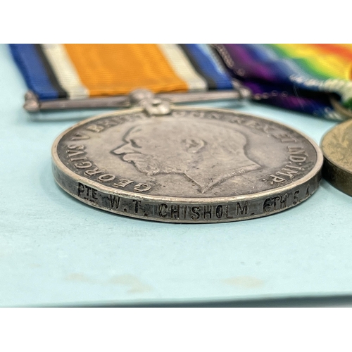 2029 - Three WWI South African items presented to 5588 Pte. W. T. Chrisholm 6th S.A.I., one medal pair and ... 