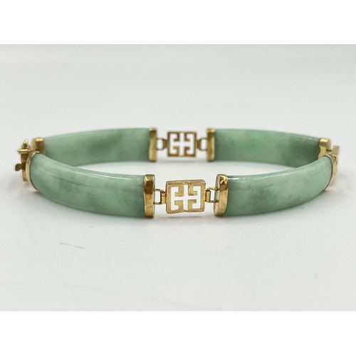 2235 - An Oriental yellow metal and jade panel bracelet - approx. gross weight 14.7g and 18cm long