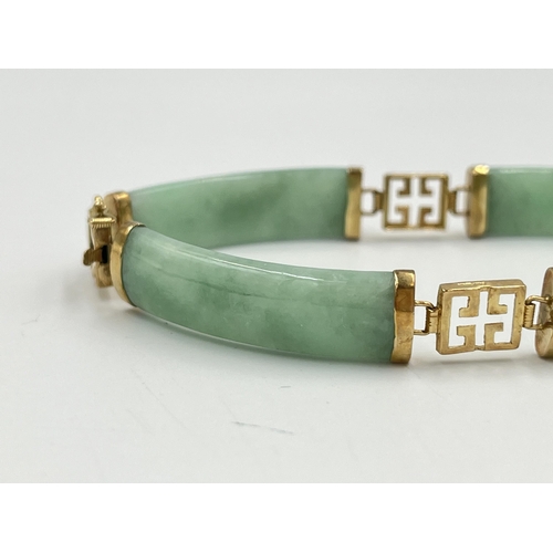 2235 - An Oriental yellow metal and jade panel bracelet - approx. gross weight 14.7g and 18cm long