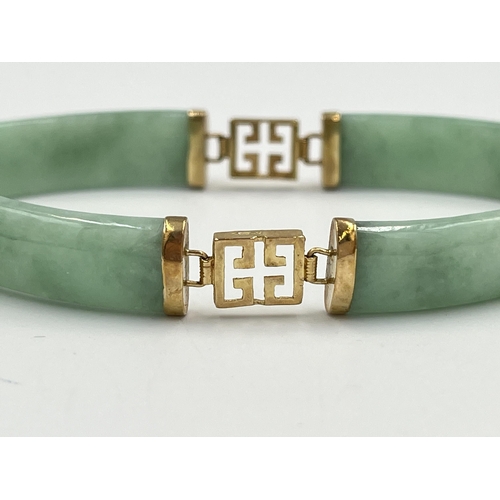 2235 - An Oriental yellow metal and jade panel bracelet - approx. gross weight 14.7g and 18cm long